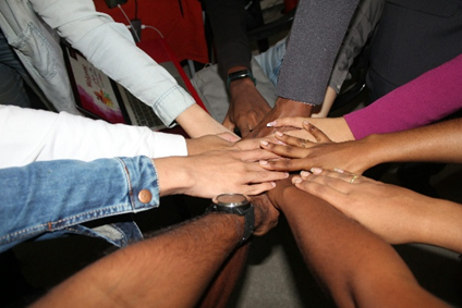Hands clasped together showing unity